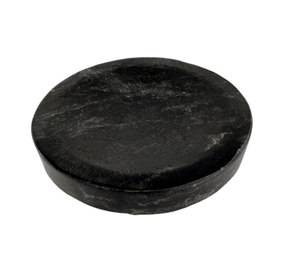 Round black stone coaster on a white background