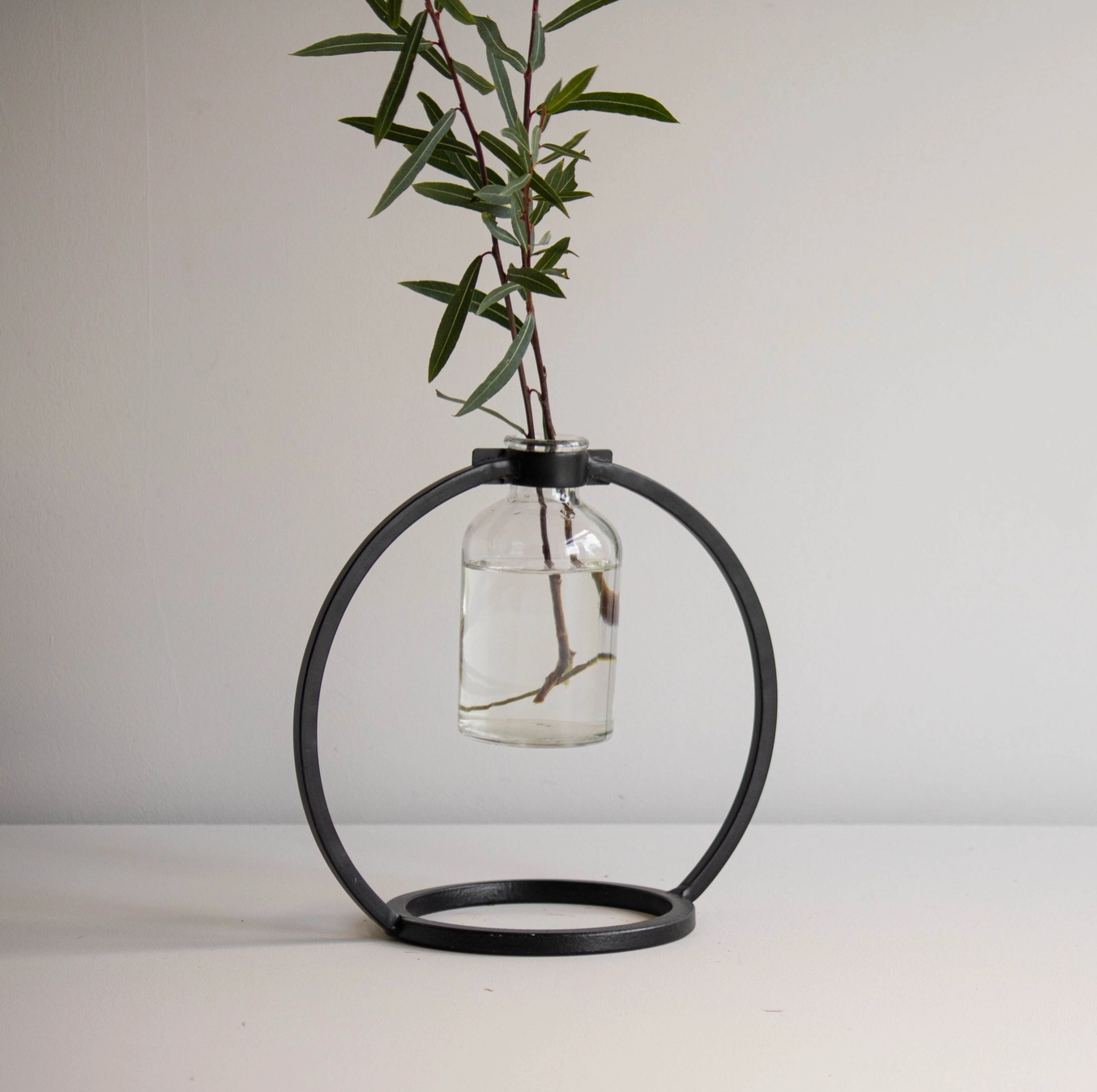 Capstone Floating Glass Bud Vase Brass & Black Finish Metal | Home Decor - Rustike Home