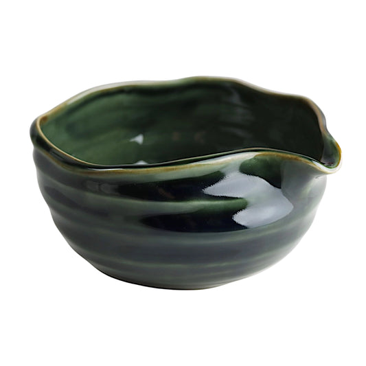 Green matcha ceramic bowl on a white background